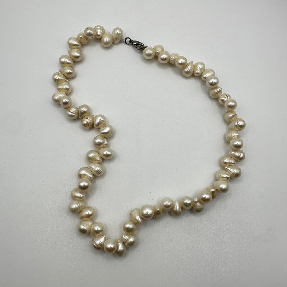 16" of all 10mm (ish) freshwater pearl necklace with silver tone metal hardware!